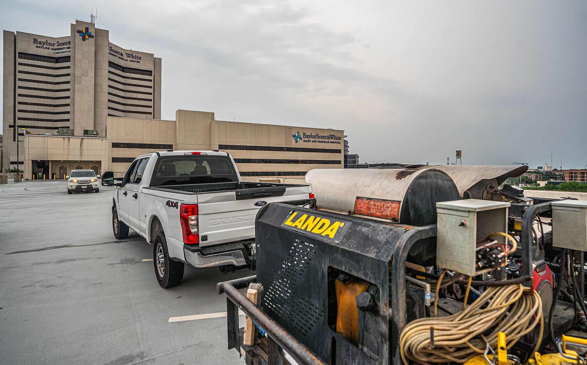 Back view of truck with hitch on top level of parking garage