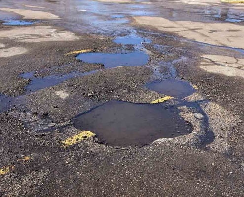potholes in a parking lot