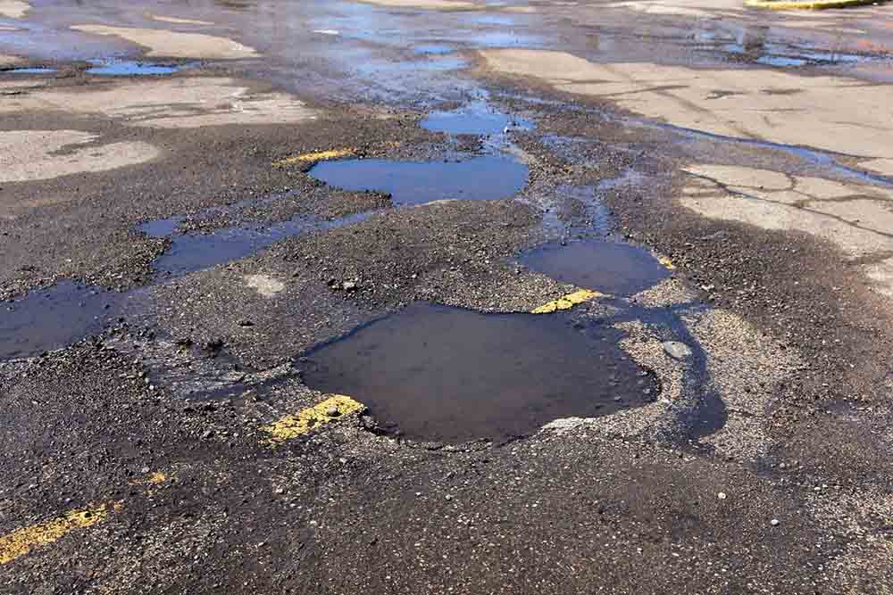 potholes in a parking lot