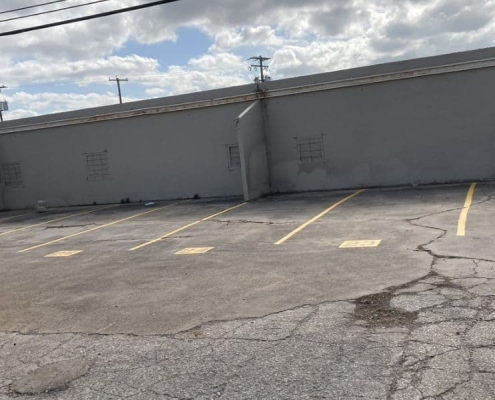 cracked and faded parking lot spots