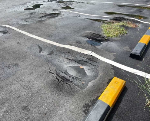 damaged parking lot concrete