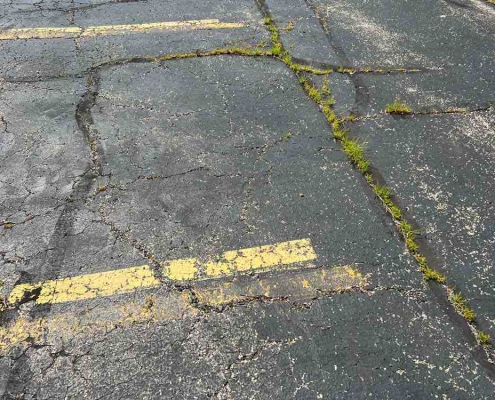 cracked parking lot concrete
