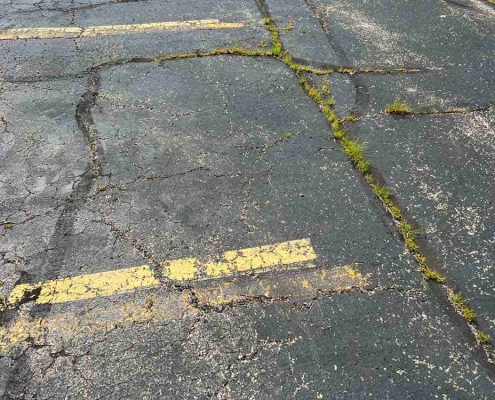 cracked parking lot asphalt
