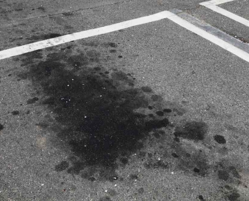 parking lot asphalt with oil stains