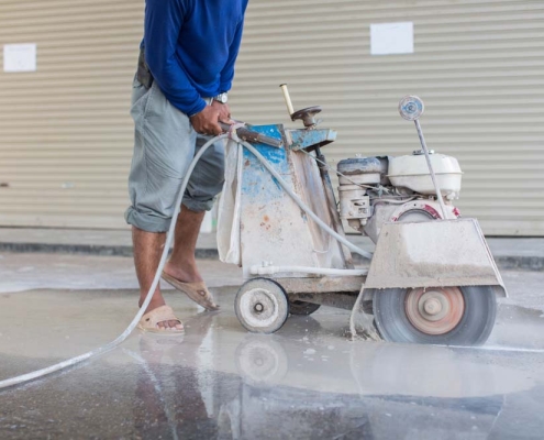 parking lot surface being pressure washed