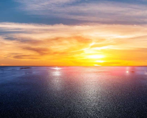 harsh/bright sun shining on asphalt